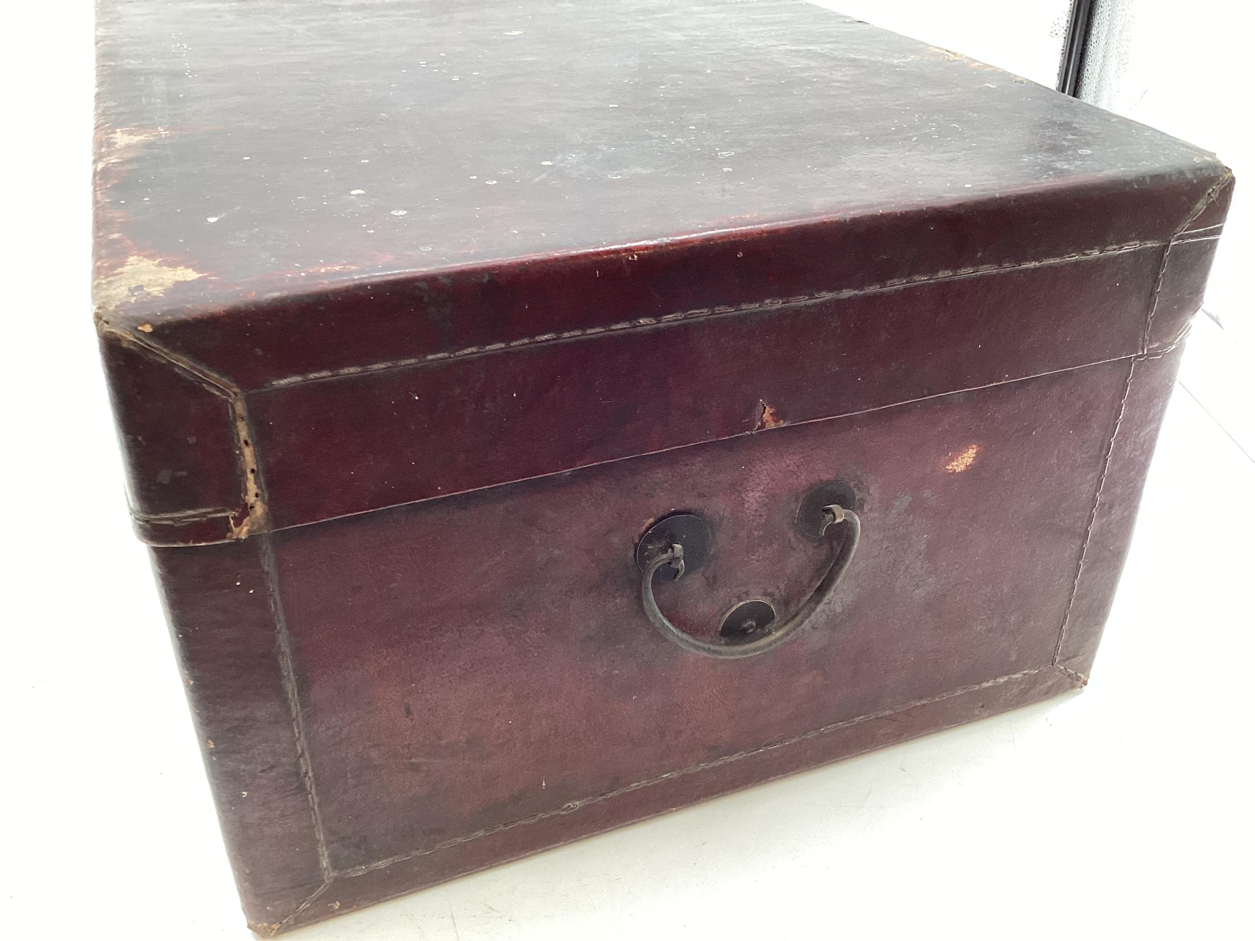 A near pair of Chinese C19th style lacquer trunks with fabric lined interiors and brass carry - Image 13 of 21