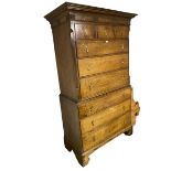 Georgian light honey coloured oak Chest on chest, moulded cornice, with carved roundel decoration,