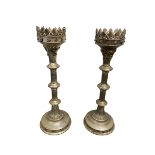 Pair of tall weathered candle stands with Pineapple Finials, on tripod feet; and a pair of