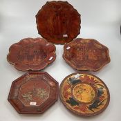 A collection of Chinese C19th style lacquered and gilt decorated wooden platters and dishes, (5),