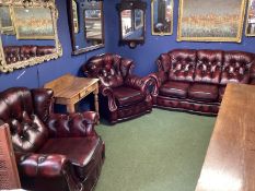 A WINCHESTER FURNITURE, red leather button backed suite of a two seater sofa and 2 large armchairs