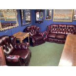 A WINCHESTER FURNITURE, red leather button backed suite of a two seater sofa and 2 large armchairs