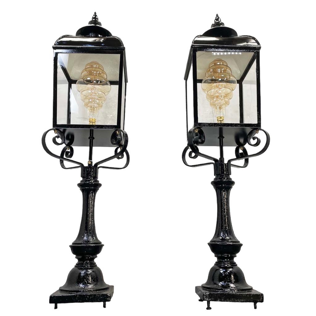 A good pair of cast metal external pedestal lanterns, circa 1900, been recently restored and