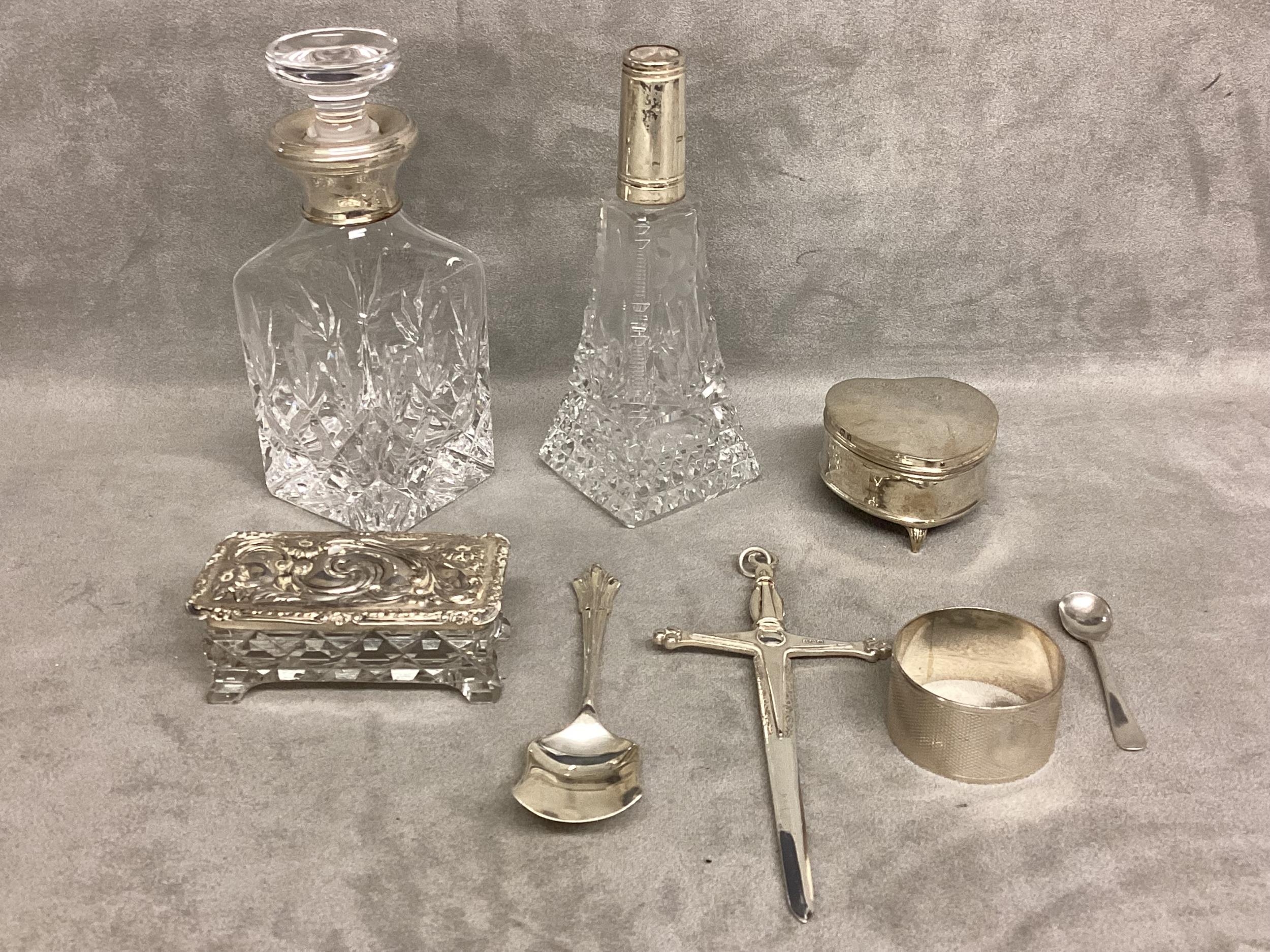 A collection of sterling silver items, to include silver topped dressing table items, heart shaped