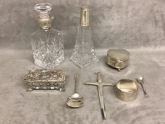 A collection of sterling silver items, to include silver topped dressing table items, heart shaped