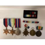 A family collection of WWII medals, 14-18 Star, War and Victory Medal to PO 18395 PTE W J Merry,