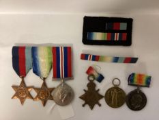 A family collection of WWII medals, 14-18 Star, War and Victory Medal to PO 18395 PTE W J Merry,