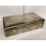 A large sterling silver cigarette box, with cedar lining, 23 x 13 x 6cm, by Goldsmiths