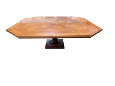 A hexagonal Coffee table on single turned support with Sorento style inlaid top, 130 x 44cm