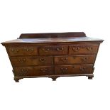 A late C18th style Georgian oak chest/dresser, three short drawers over 2 banks of two short drawers