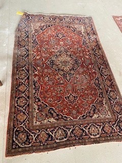 A Kashan rug, with some wear and losses, 198 x 128 cm