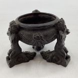 An Italian C17th style bronze perfume censor circular Design with 3 cast Putto supports and swag