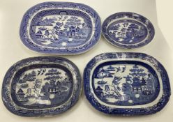 Four ceramic Willow Pattern serving dishes, largest 43cm x 35cm