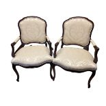 A good pair of traditional French style open arm chairs on cabriole legs with cream upholstery