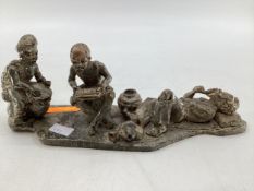 An African hardstone figural group, indistinctly signed and dated to base, 39 x 14 x 11cm