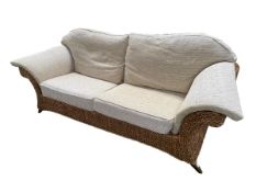 A good large rattan conservatory sofa with fitted upholstered cream cushions, 215 x 98 x 92cm,