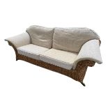 A good large rattan conservatory sofa with fitted upholstered cream cushions, 215 x 98 x 92cm,