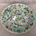 A C19th Chinese Celadon Porcelain plate decorated in Polychrome enamels, birds, butterflies, and