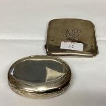 A large oval sterling silver pocket snuff box squeeze open together with a Sterling silver cigarette