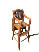 Two C19th style Chinese hardwood child's high chairs, one with lift over tray table, rattan seat and