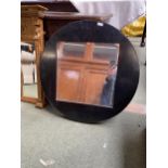 A modern circular wall mirror