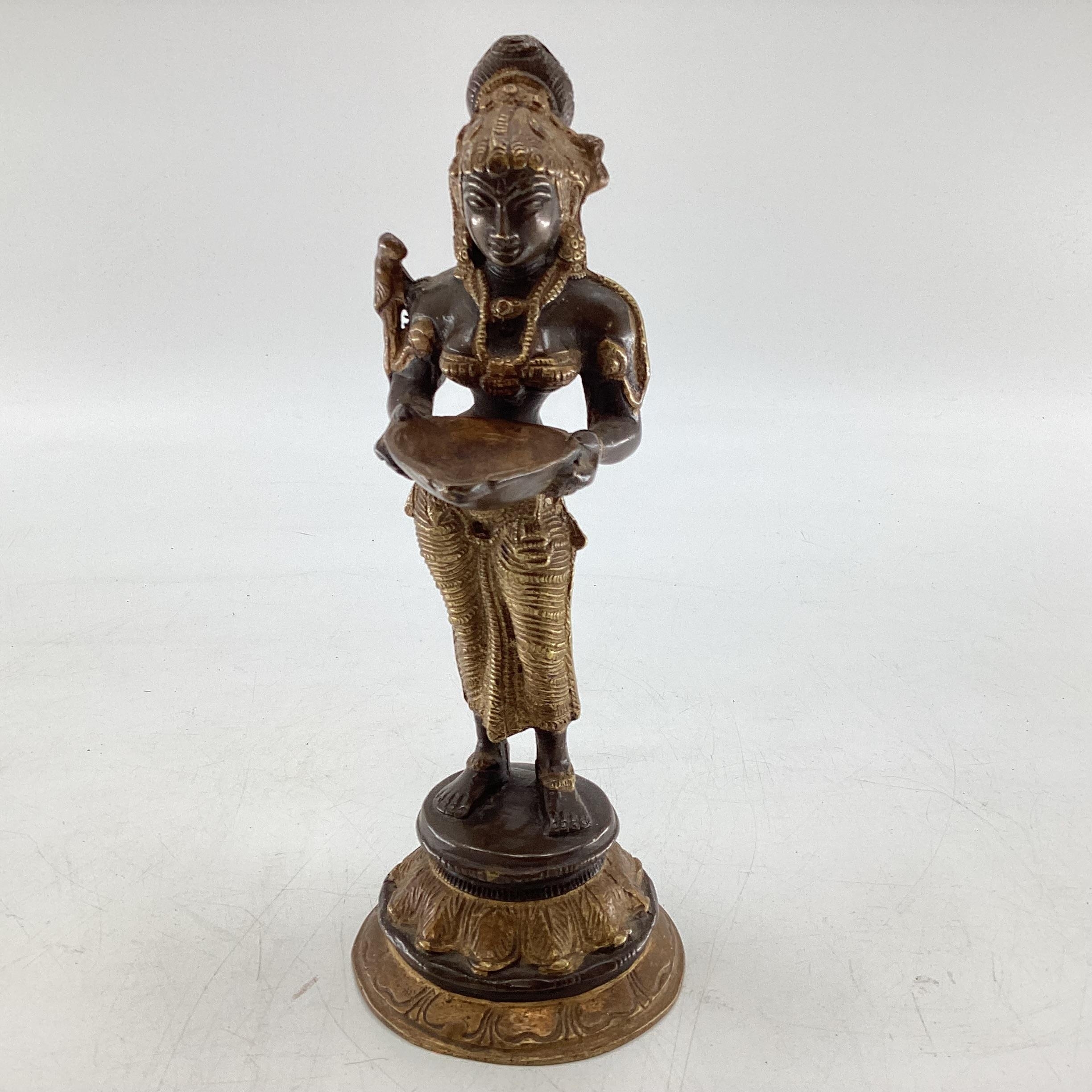 A South Asian bronze figure of Deepa Lakshmi (representation of the Hindu Goddess Lakshmi) symbol of