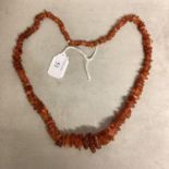 An unpolished strand of graduated amber beads, 62cm