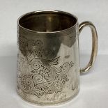 A Sterling silver mug with chased scrolling decoration, loop handle, Birmingham 1910 7.5cmH, 96g
