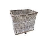 A very large vintage wicker laundry basket/ log/wood basket. Some wear to wheels/base. Very