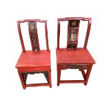 Two similar C19th/C20th Chinese red lacquered arm chairs with slat backs, bow fronts and stretchers,