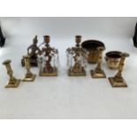 A collection of metalware to include a cast brass stand, two samovars and other items.