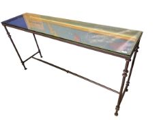 A narrow glass top and metal base console table 161cm Long x 41cm W x 81cm H