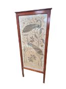 An Oriental style embroidery of two peacocks, in a large wooden and glazed A frame