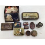 A collection of early 20th century advertising tins.