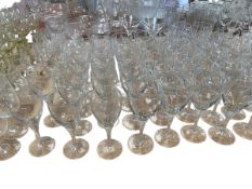 A quantity of glasses, to include a set of hock wine glasses with etched crest to bowl, a quantity