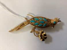 A marked yellow 18ct gold and turquoise set parrot brooch in a chinese style. 6.38g.