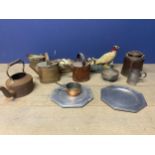 A mixed collection of metalware to include brass and copper items .