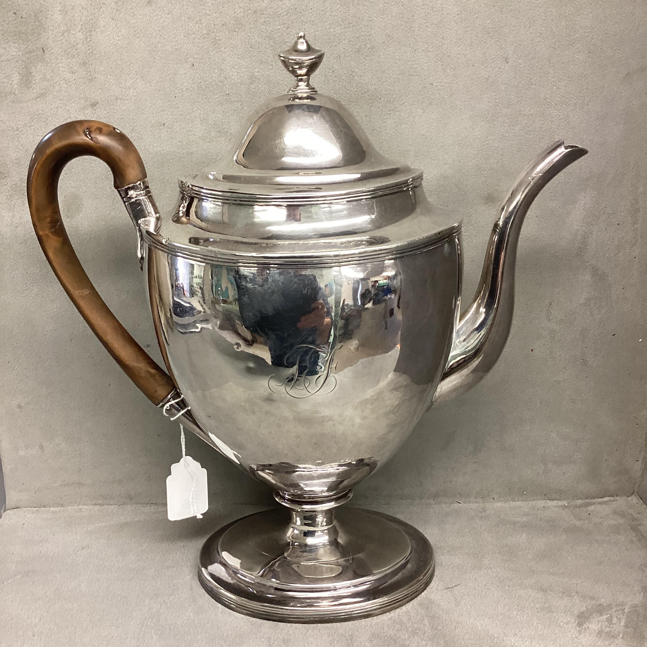 A large Sterling silver coffee pot in The Adams style with fruit wood handle on oval stepped base by - Image 2 of 7