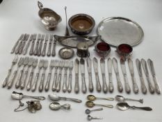 A collection of silver plated wares to include a pair of salts , wine bottle coaster, and other