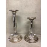 A pair of adjustable Dutch marked solid white metal column candlesticks .