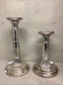 A pair of adjustable Dutch marked solid white metal column candlesticks .