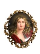 A Mourning pendant/Brooch central oval porcelain plaque with pierced unmarked yellow metal