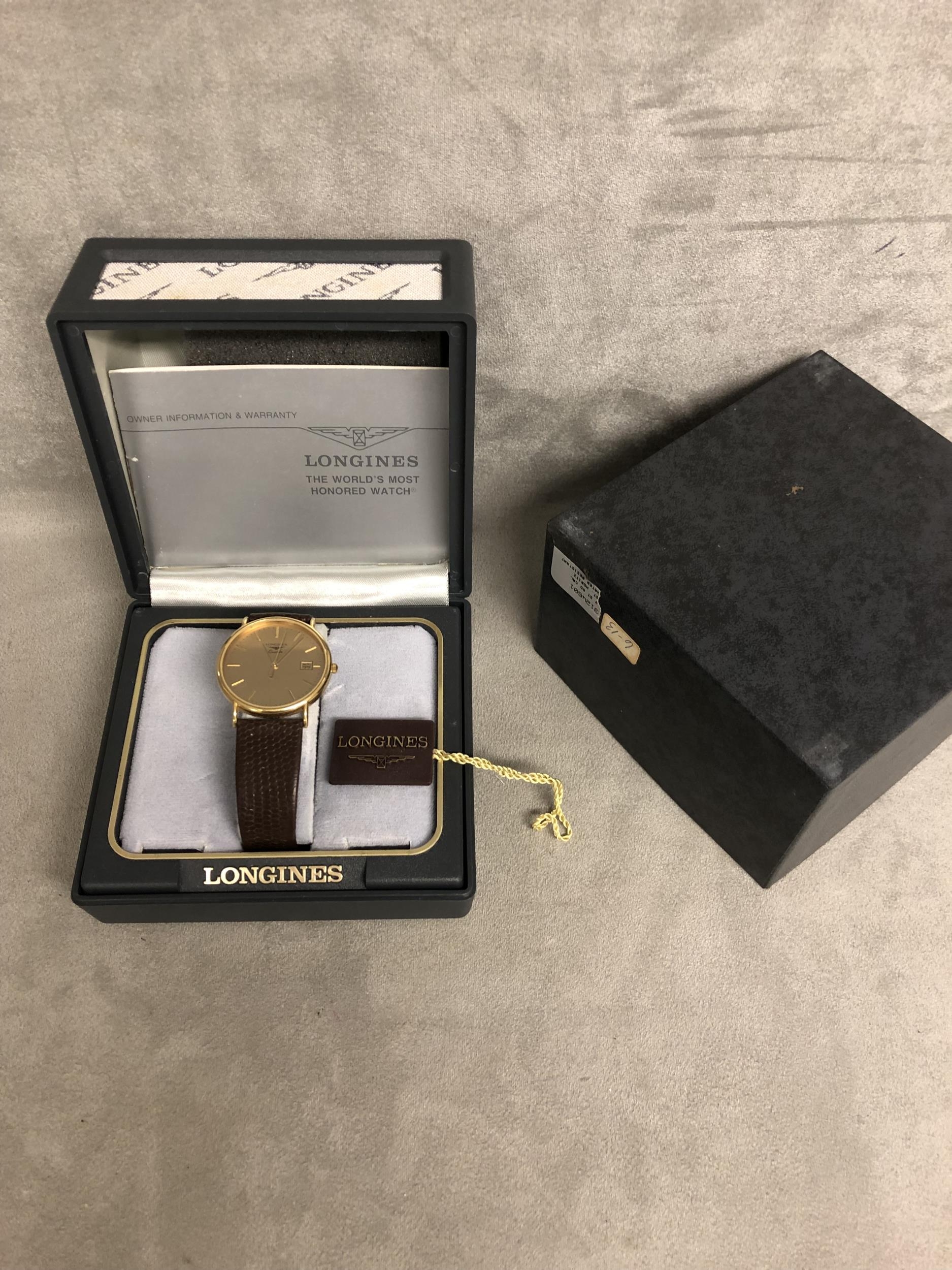 An unmarked yellow metal Gents Longines wristwatch.Quartz movement. Yellow metal 32mm case with gold - Image 2 of 3