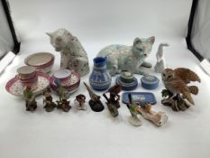 A pink lustre ware tea set together with two ceramic cats , Wedgwood items, birds etc.