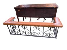 A good wrought iron club fender with brown leather top, overall length187cm x 55cm, the external