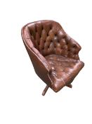A good Hillcrest swivel tub arm chair in studded button back leather, with serpentine apron on a
