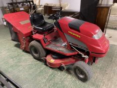 A garden tractor mower, SEE IMAGES for maker and condition. Sold as seen. Not tested. Working with