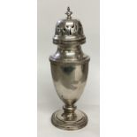 A sterling silver sugar shaker by Walker and Hall Sheffield 1914. 222g. 20cm