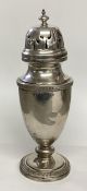 A sterling silver sugar shaker by Walker and Hall Sheffield 1914. 222g. 20cm