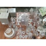 A collection of glassware to include a Moser style decanter and four glasses, decanters, vases and